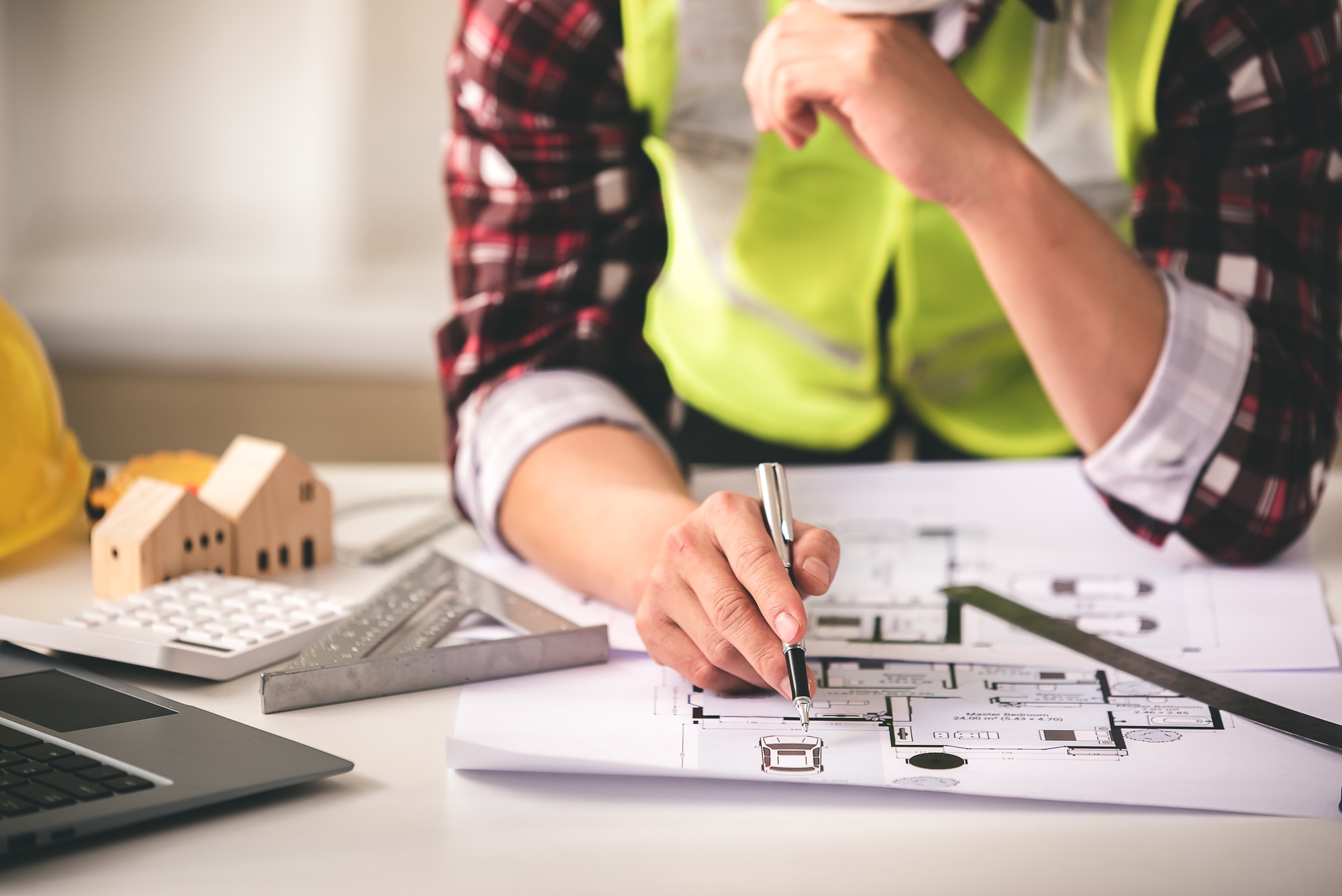 architect concept, working architect with blueprints in office to present to customers